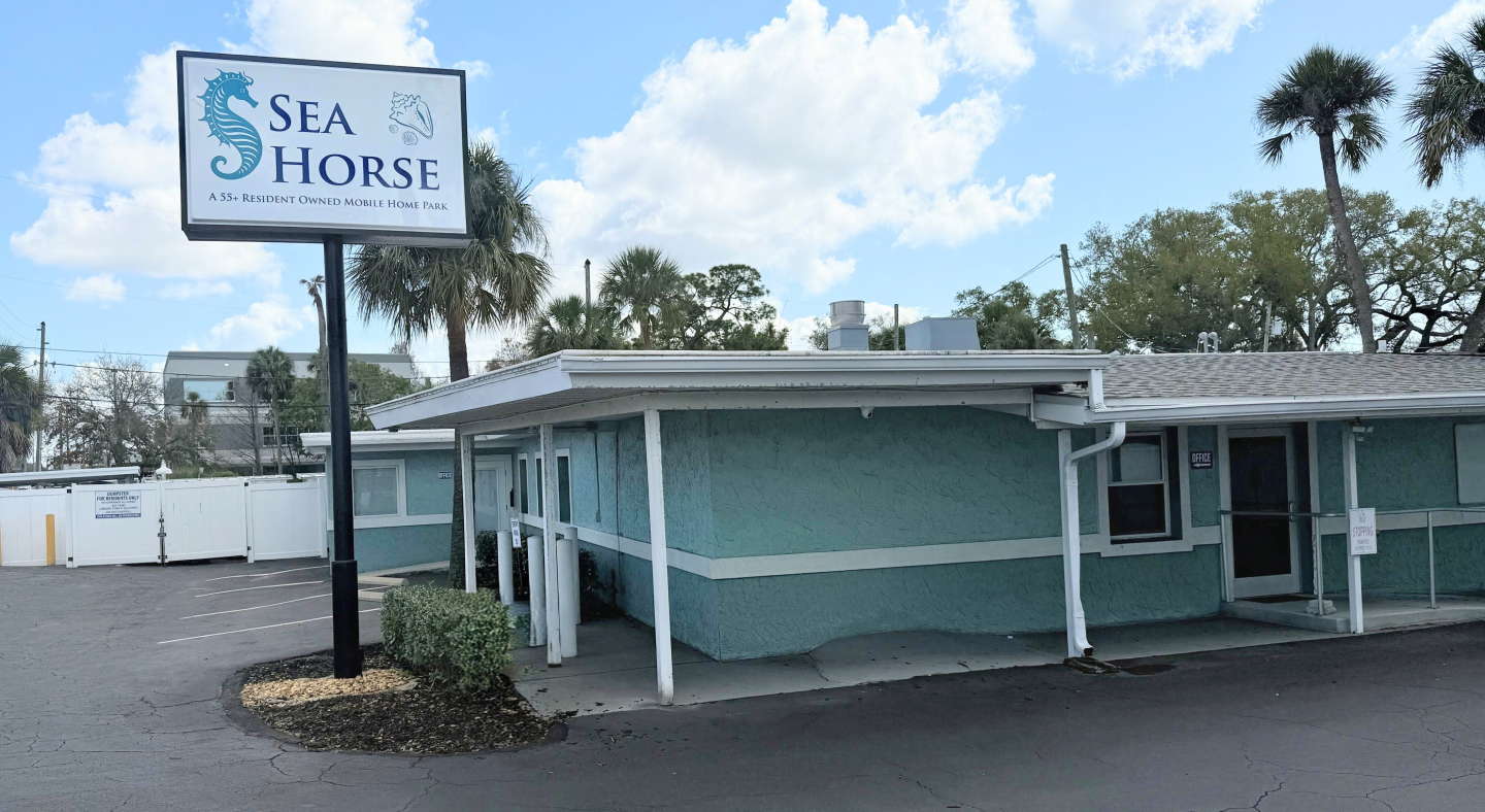 Hero Image of the Office and Clubhouse at the Park Enterance.